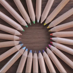 Video, no sound.  Shows an animation of colored penciles seemingly spinning around a circle. Mini Colored Pencils. FSC certified wood. Pre-sharpened. 24 colors, Compact & travel-ready case. Brandless. Designed for on-th-go creativity.