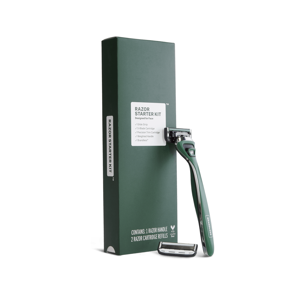 Product photo, brandless razor starter kit for face. Razor leaning up against the starter kit box in a forrest green and silver color, spare cartridge sits next to the handle.