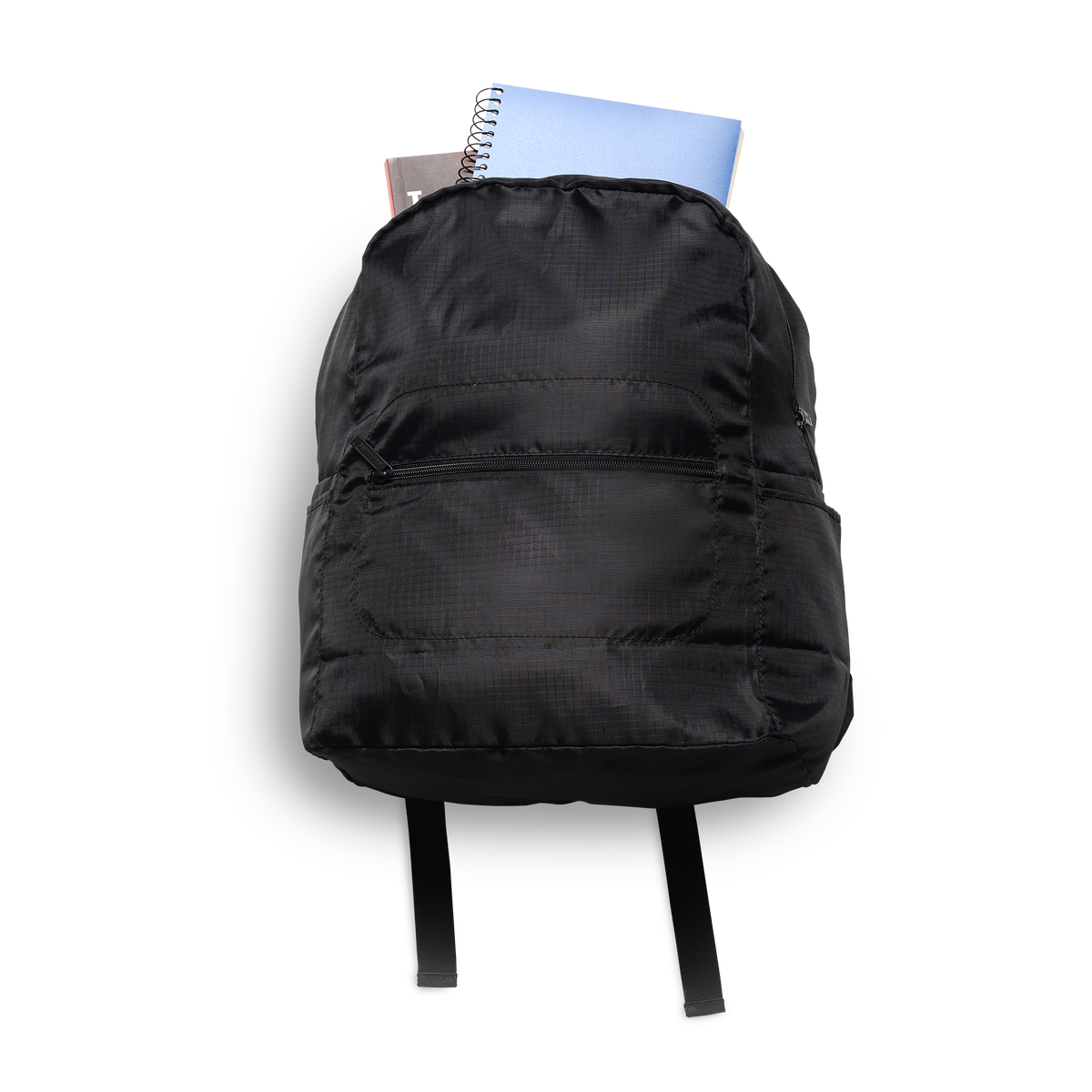 Photo showing the backpack with school supplies poling out the top.