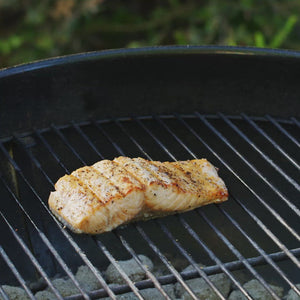 Video, no sound.  Grill spatula used to slide effortlessly underneath delicate foods like this fish fillet. Grill spatula. Stainless steel. Large perforated blade. Non-slip nylon handle. Serrated edge for cutting. Brandless. Designed for outdoor grills.